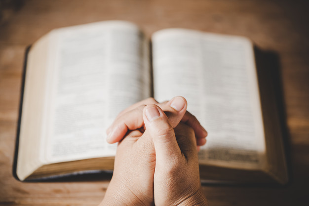 spirituality-religion-hands-folded-prayer-holy-bible-church-concept-faith_1150-14889